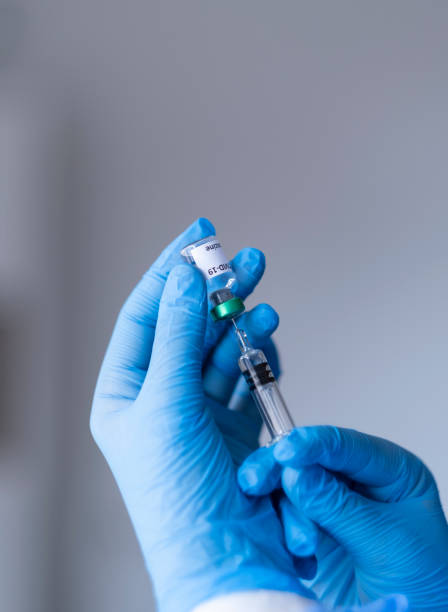 istock Close-up medical syringe with a vaccine. 1294488621