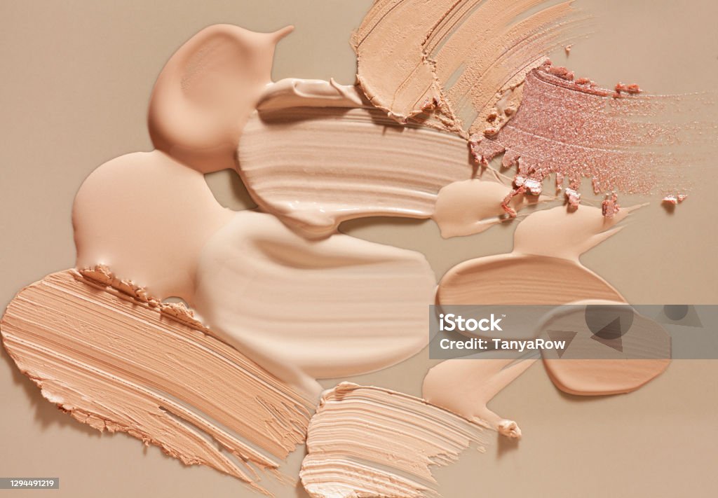 Smudged make-up gradient texture palette creamy matte concealer foundation CC or BB-cream powder on white and beige isolated background Smudged make-up gradient texture palette creamy matte concealer corrector cover foundation CC or BB-cream powder on white and beige isolated background Make-Up Stock Photo