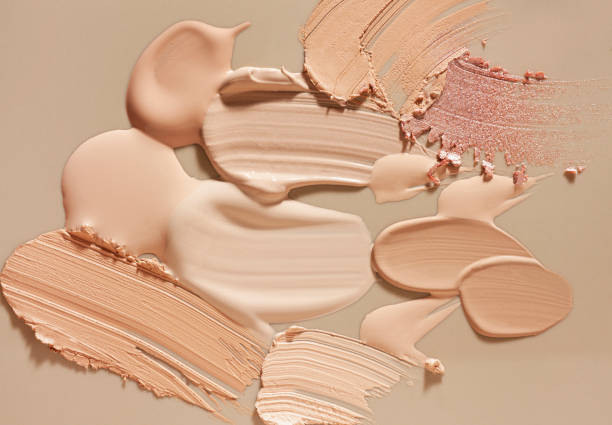 Smudged make-up gradient texture palette creamy matte concealer foundation CC or BB-cream powder on white and beige isolated background Smudged make-up gradient texture palette creamy matte concealer corrector cover foundation CC or BB-cream powder on white and beige isolated background lotion texture stock pictures, royalty-free photos & images