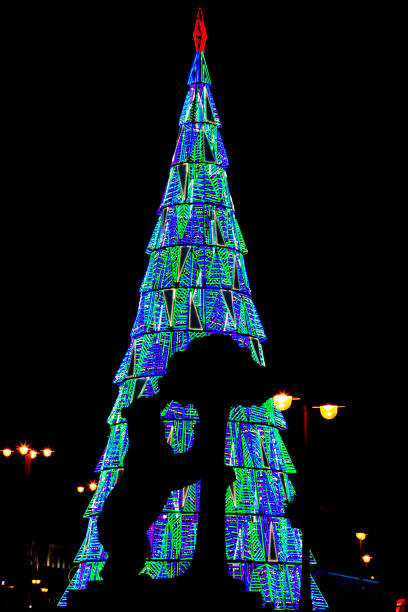 istock Madrid, Spain- January 4, 2021: Bear and Strawberry tree with Christmas tree at Puerta del Sol in Madrid 1294492821