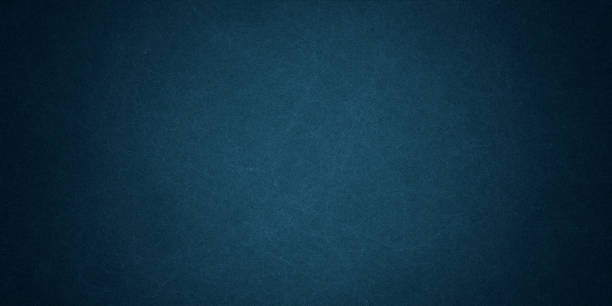 istock Texture of old navy blue paper closeup 1294493812