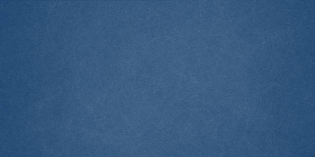 istock Texture of old navy blue paper closeup 1294493817
