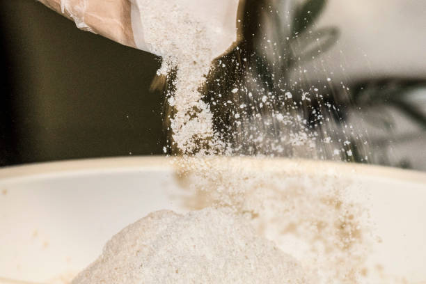istock pouring flour into a bowl 1294495129