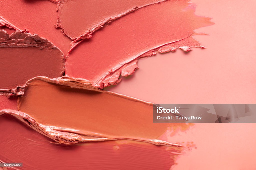 Smudged vibrant red purple scarlet pink claret maroon textured tint or lipstick on white isolated background Smudged vibrant red purple scarlet pink claret maroon textured tint or lipstick on white and multi-colored isolated background Make-Up Stock Photo