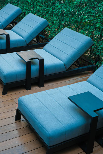 istock Blue poolside sofa on wooden floor 1294496306