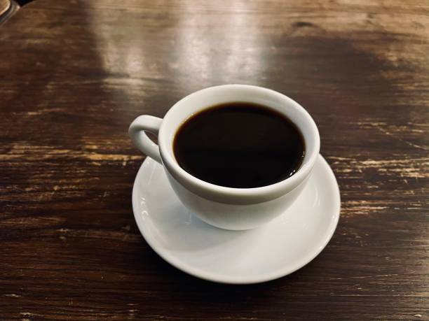 istock black coffee in a white cup on a wooden table 1294501090