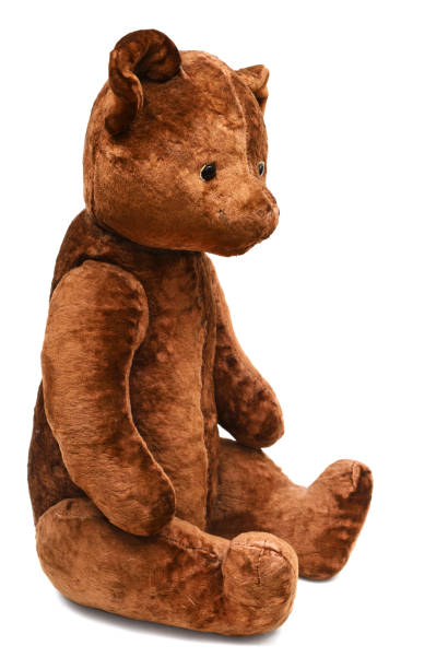 istock sitting shabby teddy bear on a white background 1294502126