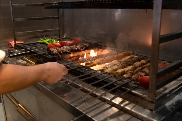 istock Chicken and meat kebabs with vegetables at grill. 1294505113