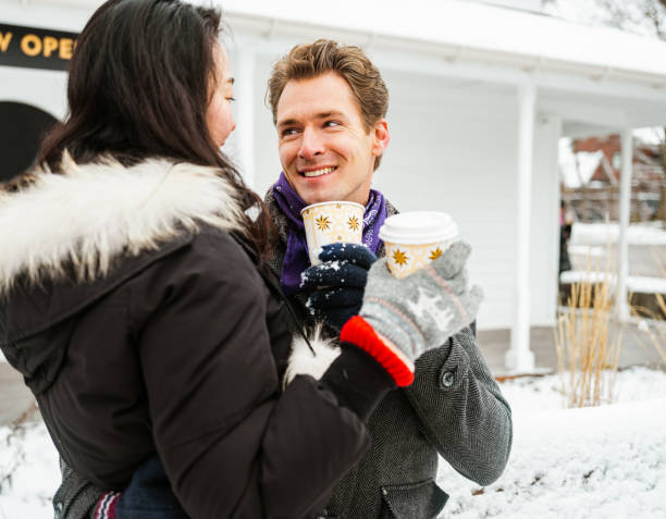 istock Mixed race couple drinking coffee outdoors 1294505156