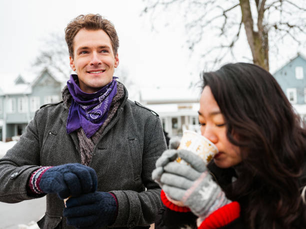 istock Mixed race couple drinking coffee outdoors 1294505177