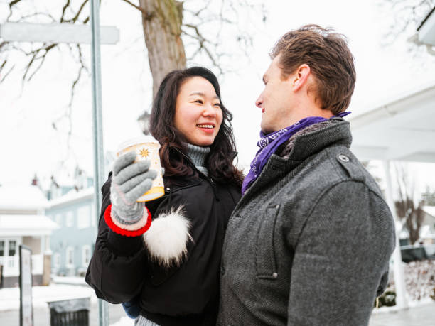istock Mixed race couple drinking coffee outdoors 1294505201