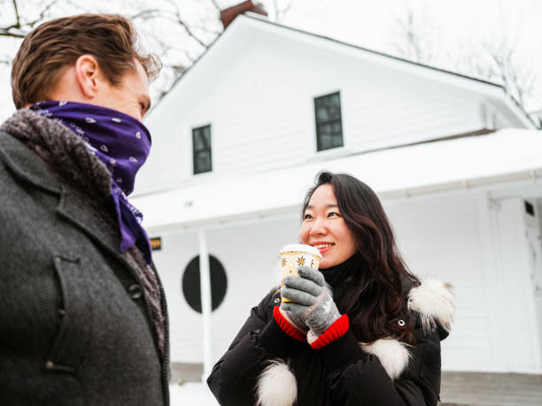 istock Mixed race couple drinking coffee outdoors 1294505220