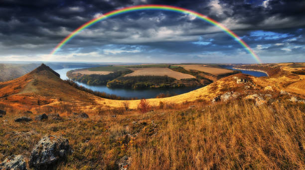 istock colorful rainbow over river canyon. autumn landscape 1294505780