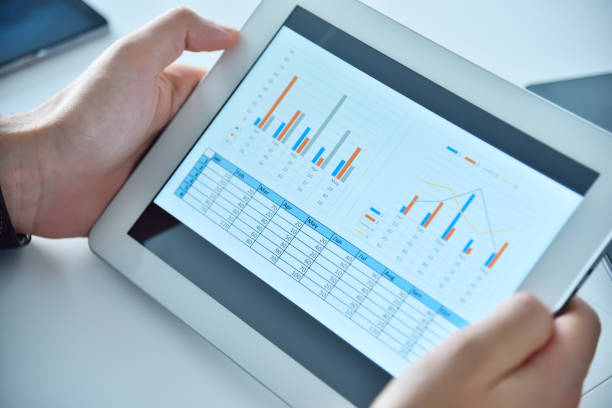 istock Businessman hands using digital tablet with business report. 1294508244