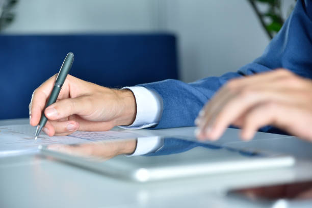 istock Financial auditor working in office and analyzing financial results. 1294508288