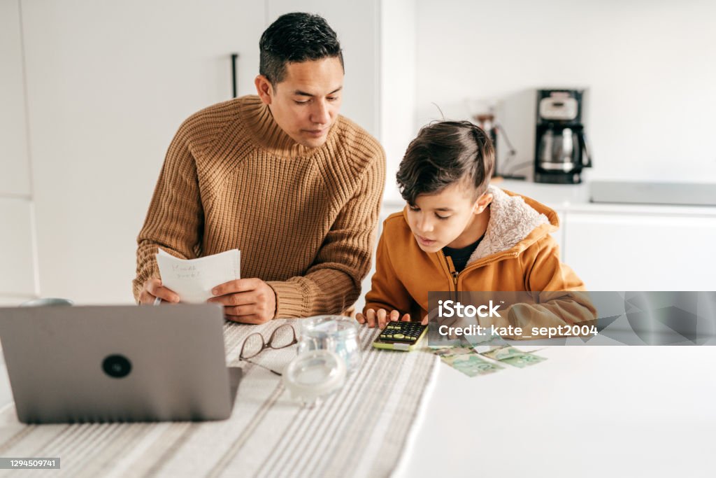 Dad and son - homeschooling from home office Child Stock Photo