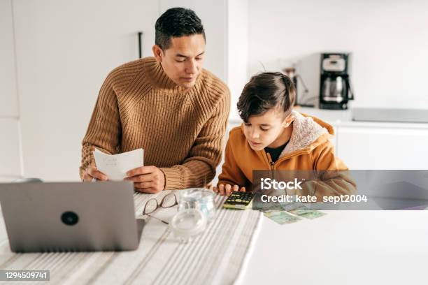 Dad And Son Homeschooling From Home Office Stock Photo - Download Image Now - Child, Currency, Finance