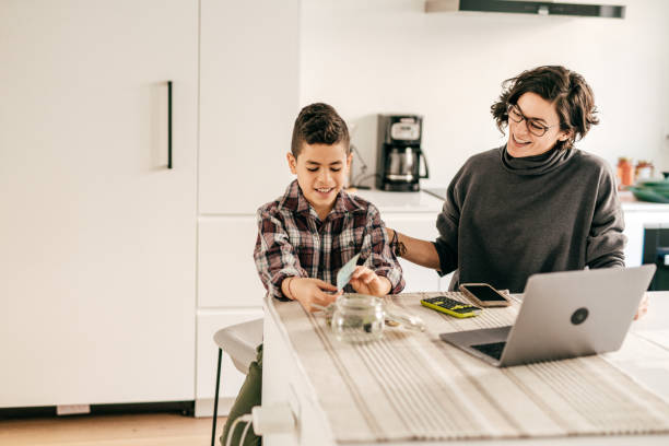 Boy learning math with cash and money planning