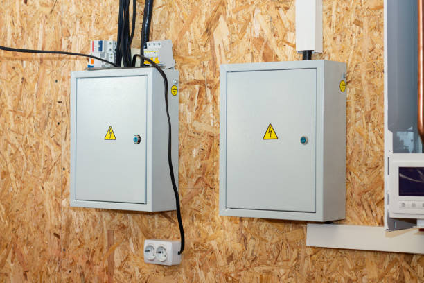 istock Junction boxes with electrical switches inside a house under construction on a wall clad with OSB, oriented strand board 1294510026