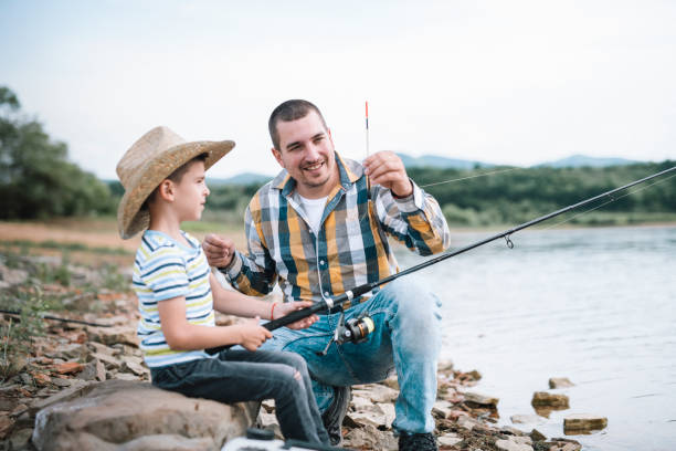 istock Father teaching his son how to fishing. 1294510661