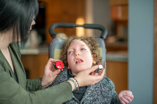 young girl living with a disability - motorized wheelchair audio imagens e fotografias de stock