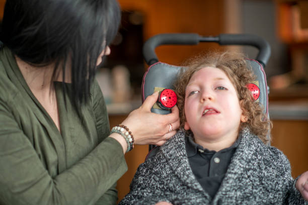 young girl living with a disability - motorized wheelchair audio imagens e fotografias de stock