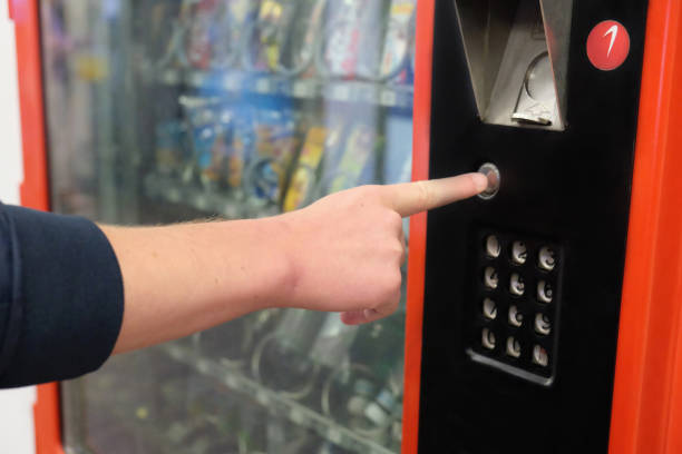 istock Unrecognizable Caucasian man buying snack from vending machine 1294518412