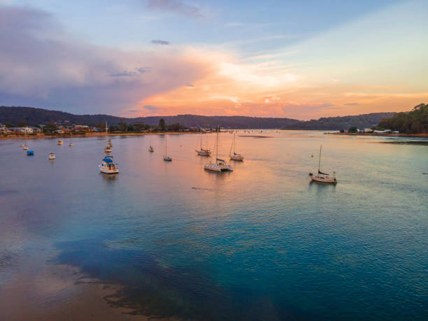istock Reverse sunset waterscape over the channel with boats and clouds 1294520878