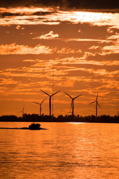 istock Green Energy - Wind Turbine at Sunset 1294521854