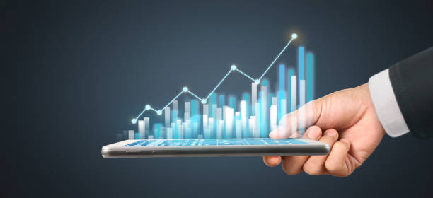 istock Graph growth and increase of chart positive indicators in his business,tablet in hand 1294522412