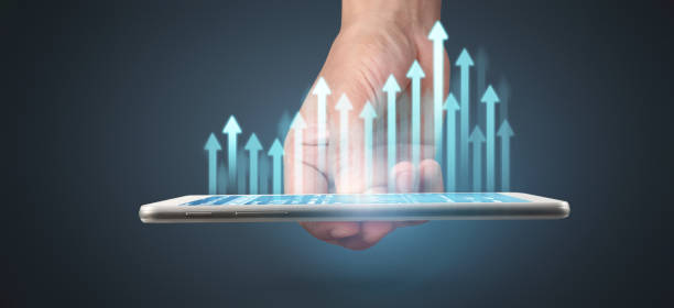 istock Graph growth and increase of chart positive indicators in his business,tablet in hand 1294522414