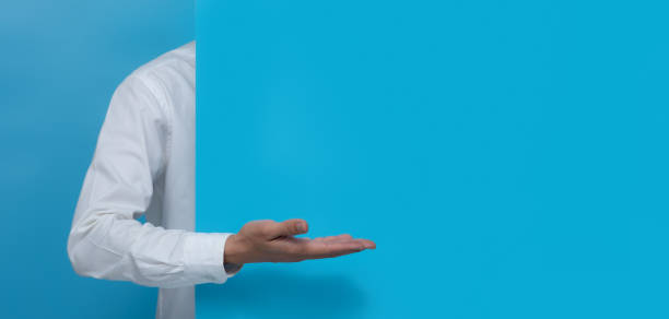 istock Open palm hand gesture of male hand on blue background,copy space for text 1294522462