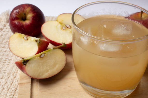istock Delicious apple juice with ice cubes 1294522636