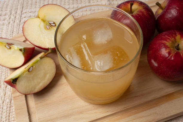 istock Delicious apple juice with ice cubes 1294522647