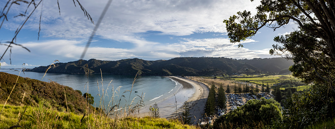 a large pano of the idyllic beach, one of New Zealand's iconic vacation getaways. Matauri Bay is just north of the Bay of Islands