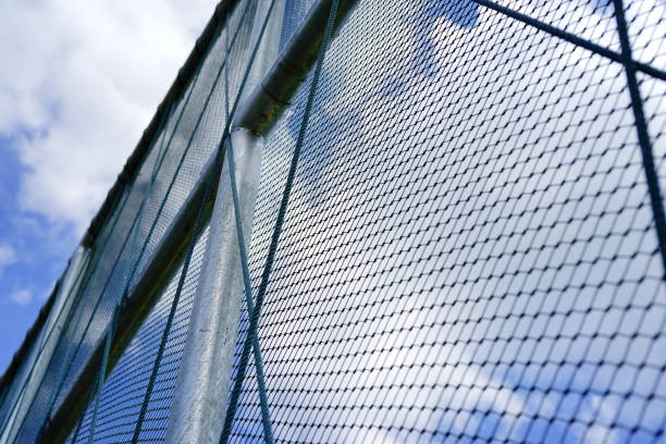 istock Steel grating grid with blue sky background 1294530731