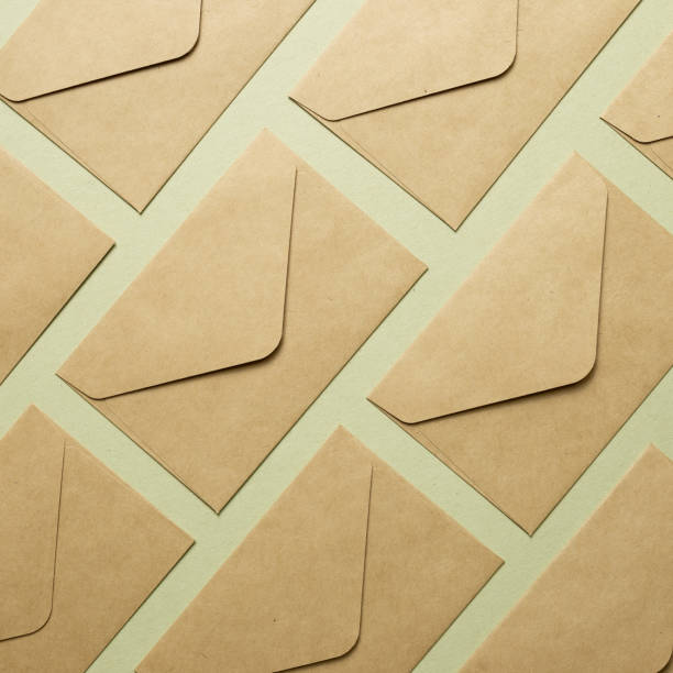 istock Kraft brown paper envelopes on khaki background. top view, copy space 1294538473