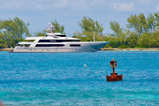 Nassau, Bahamas - March 22, 2016: The luxury yacht “MySeanna” enters the Nassau Harbor on a sunny, windy day.
