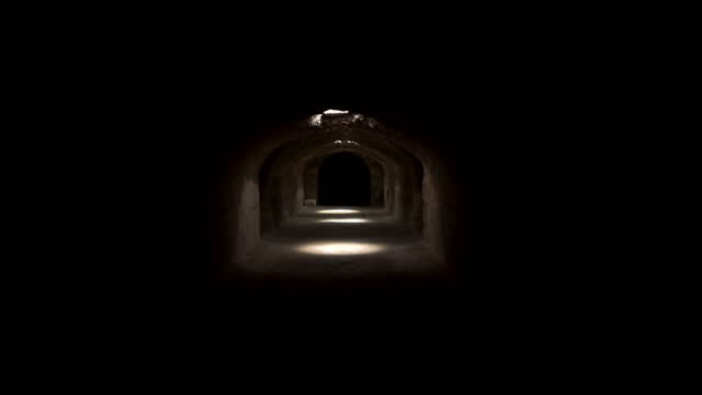Passage through a dark roman basement. Basement under the Amphitheater in El Jem, Tunis. Ancient roman building. The camera moves away