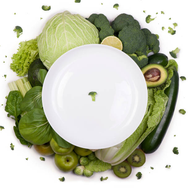 istock Group of green vegetables on white background 1294545530