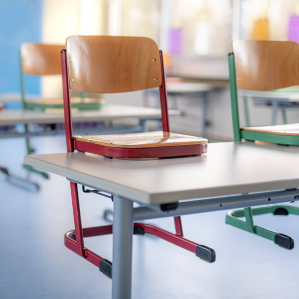 istock Red chair in a classroom stands on a table 1294546873