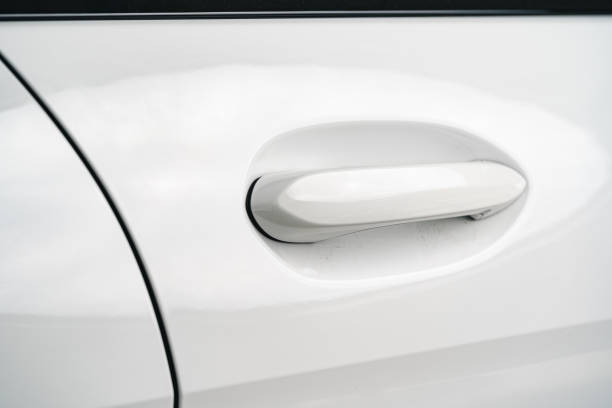 istock Modern luxury car door handle close up 1294547683