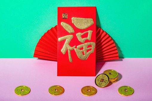 Red envelope and antique coin toys for gift chinese new year. Chinese characters mean blessing and making fortune.