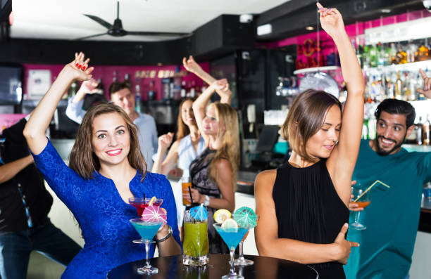 istock People celebrating birthday in bar 1294550751