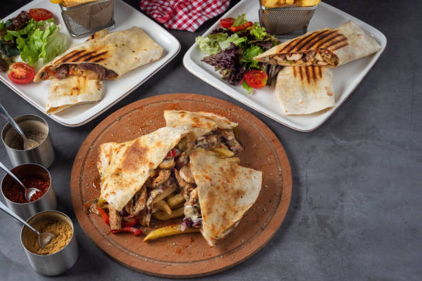 istock burritos and quesadillas on a stone background with vegetables. 1294557405