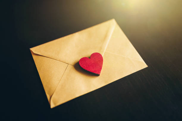 istock Saint Valentine's greeting card / letter on a dark background. Romantic / Love background / concept. Valentine's day celebration concept. 1294558111