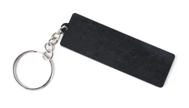 Black keychain with space for text isolated on white. Close up.