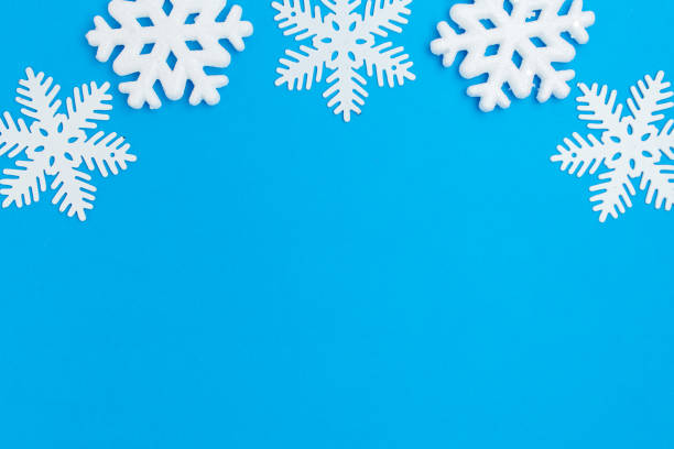 istock winter flat lay with snowflakes on blue 1294564528