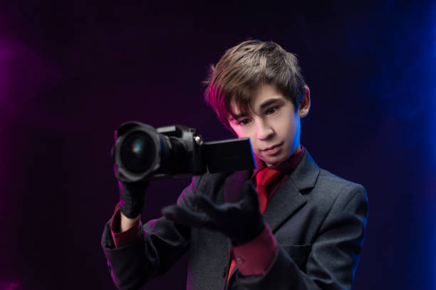 istock teen boy professional videographer with camera in hand 1294566582