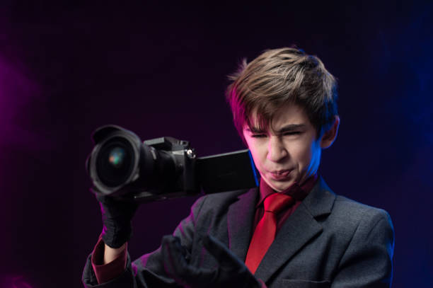 istock teen boy professional videographer with camera in hand 1294566598